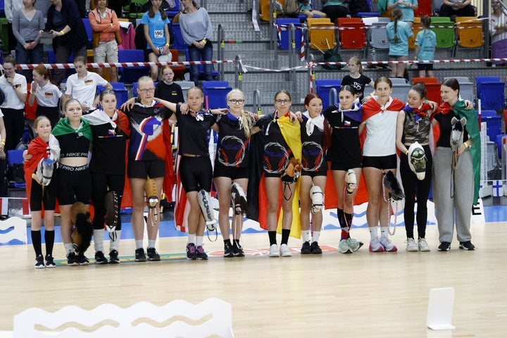 Young participants with Hobby Horses and national flags at the European Hobby Horse Championship in Prague