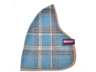 The Hobby Horse LarDen Stable Blanket Scottish Cube is a blue and beige plaid fabric with rounded triangular edges, taupe trim, and a small pink and black label tag sewn on one side.