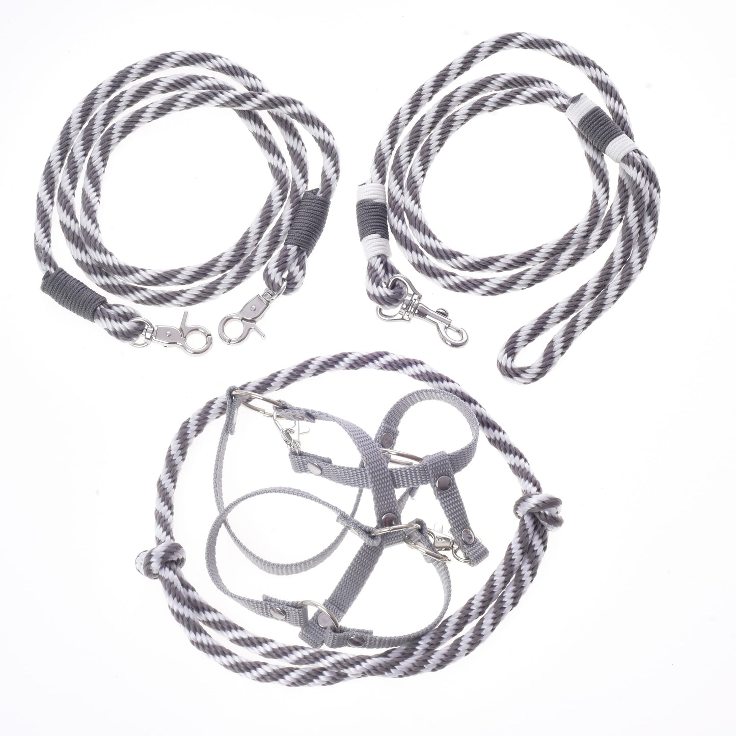 Three gray and white striped accessories from Hobby Horse LarDen’s Set Start Silver—including a halter, cordeo, lead rope, and reins—are arranged on a white background. Perfect as a matching harness and leashes or reins for your favorite hobby horse accessories.