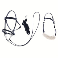 The Set Basic by Hobby Horse LarDen includes a black halter with lamb, a coiled black lead rope with metal clip, and a black noseband with white fleece—perfect accessories for your hobby horse, shown on a white background.