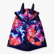 The Raincoat Rainbow (winter softshell) by Hobby Horse LarDen features a swirling abstract pattern in red, blue, pink, and purple with horn-like hood details—a vibrant, unique waterproof winter cape shown on a white background.