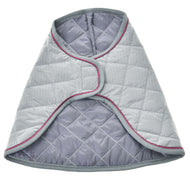 The Blanket Silver Eleganza by Hobby Horse LarDen is a quilted gray pet vest with pink piping, a wrap-around design, and soft padding, displayed flat on a white background.