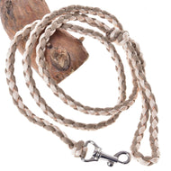 The Hobby Horse LarDen Knitted Lead Rope Double Latte, a braided beige and light brown paracord rope with a metal clasp, is looped around wood and displayed on a white background.