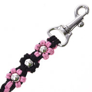 Close-up of the Hobby Horse LarDen Lead Rope Bloom Pink, a black leash with pink flower accents and silver studs, finished with a shiny metal clasp—ideal for leading or lunging your hobby horse in style.