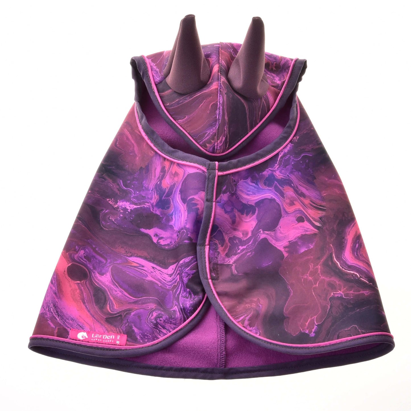 The Raincoat Galaxy Purple by Hobby Horse LarDen features a vibrant purple and pink marbled design with two pointed hooded horns, resembling a mythical dragon—perfect for all-weather riding adventures.