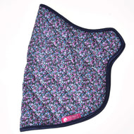 The Blanket Flower by Hobby Horse LarDen is a quilted hobby horse blanket featuring a dark blue edge, a floral pattern in blue, purple, and pink shades, plus a pink label at the bottom with a white horse logo and text.