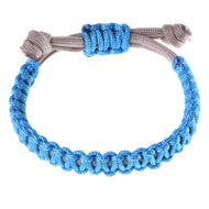 The Bracelet Nature Blue by Hobby Horse LarDen is a handmade accessory with blue braided cord, beige ties, and a knotted adjustable closure.