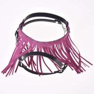 The Halter black with pink fringes by Hobby Horse LarDen is a black leather harness with long pink fringe, metal hardware, and adjustable straps, inspired by horse halters. Shown on a white background.