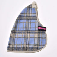 The Stable Blanket Light Blue by Hobby Horse LarDen is a triangular blue and beige plaid fleece hat with cream trim, a fluffy white tip, and a pink and black “Cat Den” tag on one side, inspired by cozy horse blankets.
