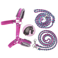 The Hobby Horse LarDen Set Perfect Combination Pink includes a pink and grey fur-padded halter, two braided blue and pink lead ropes with silver clasps, and a round badge with a black horse on pink—ideal accessories for hobby horses.