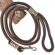 The Hobby Horse LarDen "Hobby Horse - rope stripe Vivaldi" is a brown braided rope leash with a metal clasp, coiled around a wooden stick and displayed on a white background.