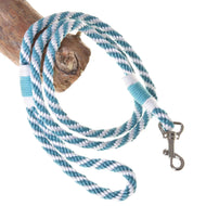 The Hobby Horse LarDen Lead Rope Turquoise Stripe, featuring blue, white, and teal stripes with a metal clasp, is looped around a piece of wood—perfect for hobby horse play or real horse equipment.